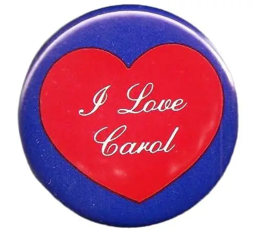 Heart-shaped pinback button with red “I Love Carol” text on blue border