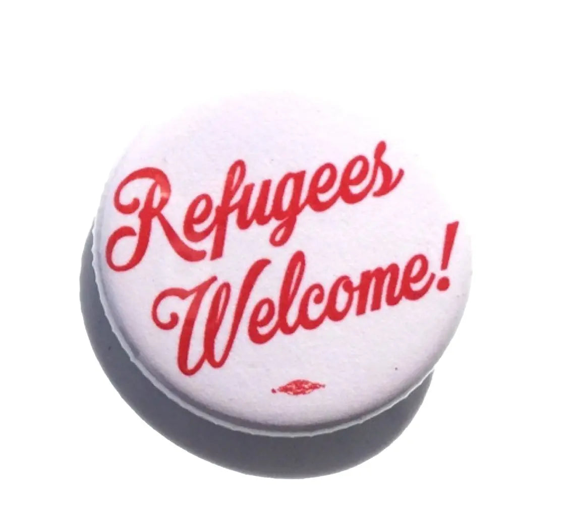White circular button badge with red 'Refugees Welcome!' text