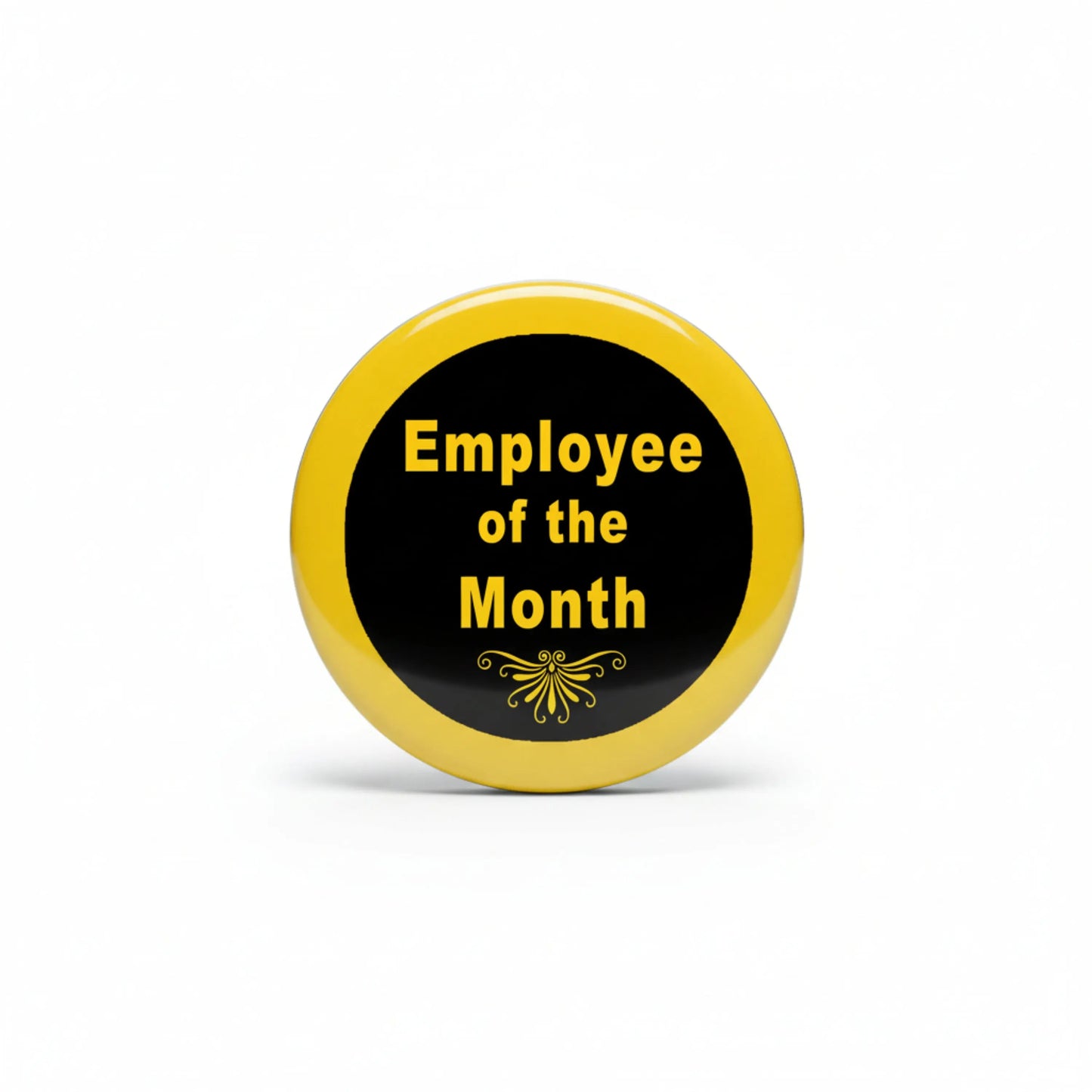Round gold enamel pin with black center reading “Employee of the Month”
