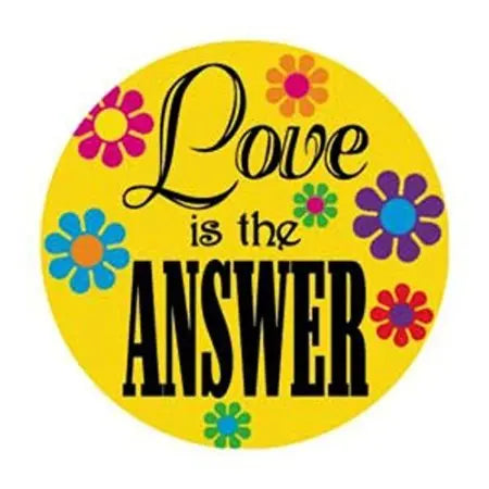 Yellow circular button pinback with colorful flowers and text 'Love is the ANSWER'.