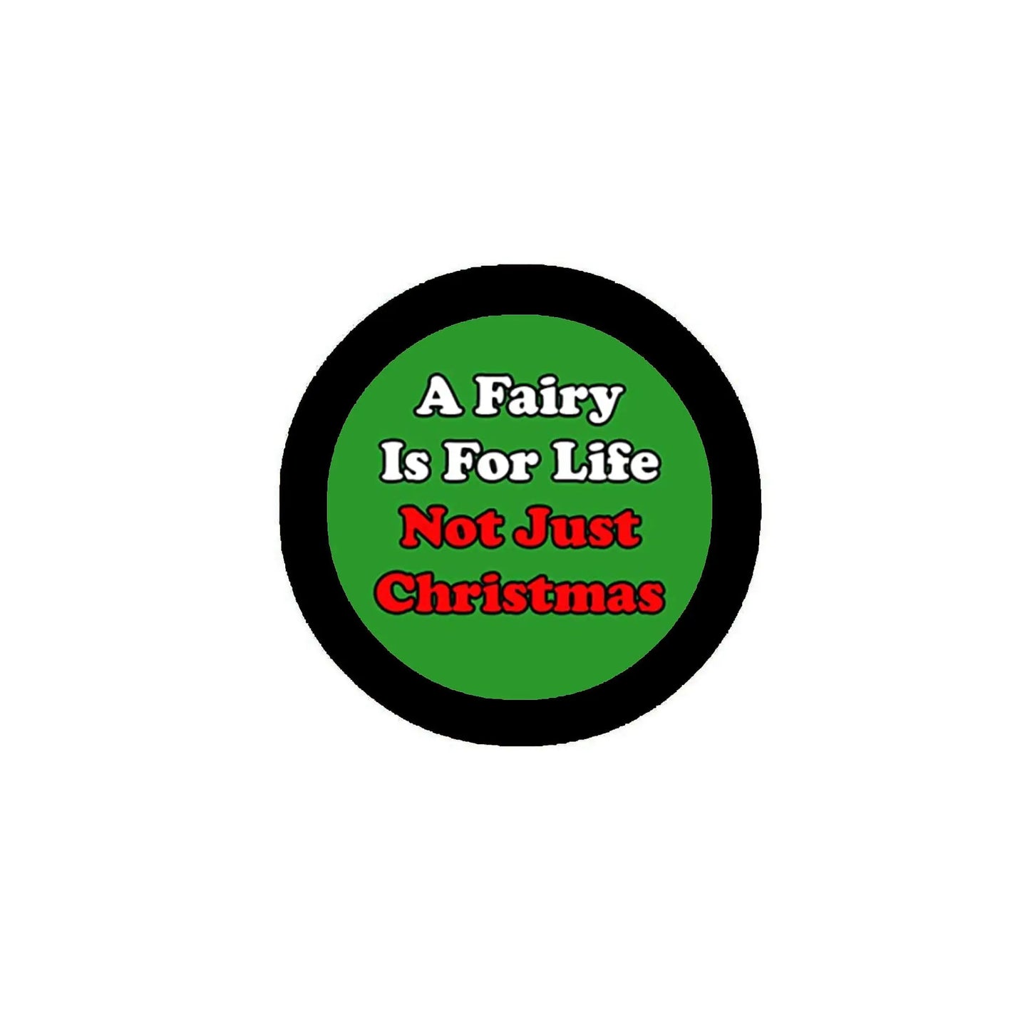 Green round pinback button with black border, slogan text about fairy life and Christmas