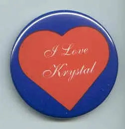 Round I Love Krystal pinback button with orange heart on blue background