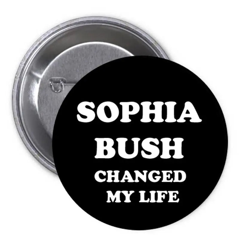 Round black pinback button with white text: "SOPHIA BUSH CHANGED MY LIFE"