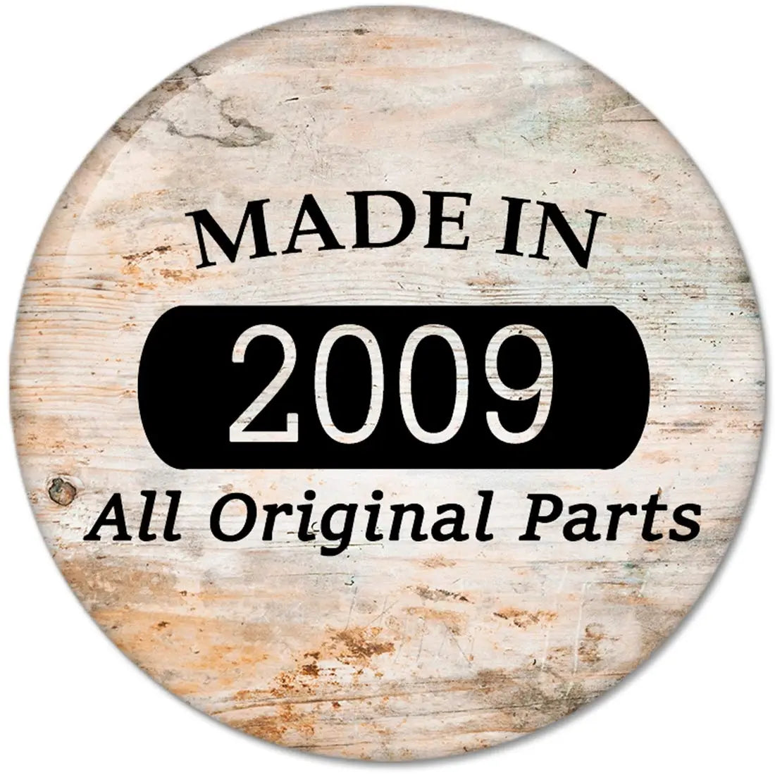 2009 pinback button with “MADE IN 2009” and “All Original Parts” text on wood-look background