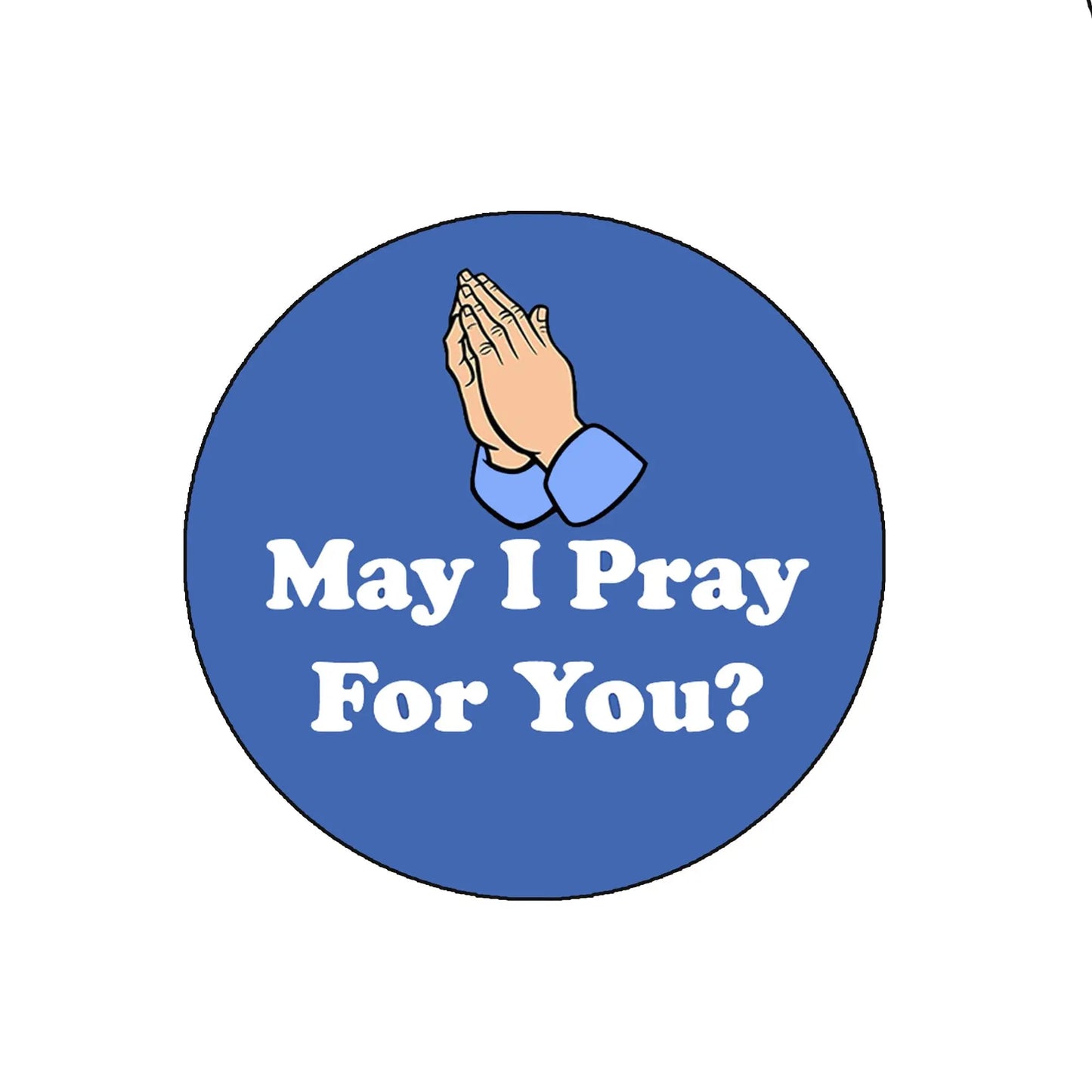 Round blue pinback badge with praying hands and text "May I Pray For You?"