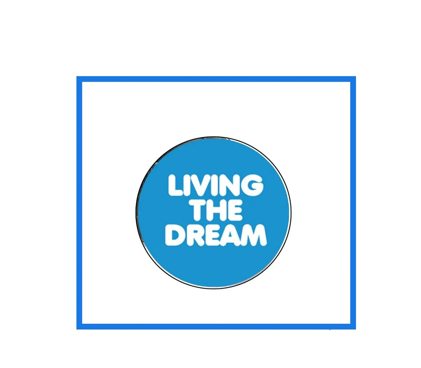 Round blue motivational pinback button with white text “LIVING THE DREAM”