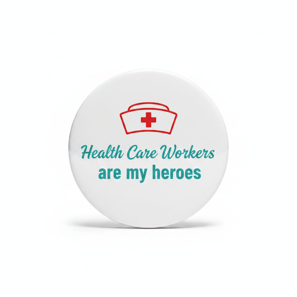 Round enamel pin with red medical cross and 'Health Care Workers are my heroes'