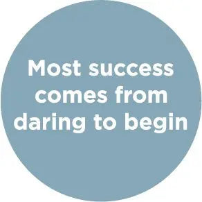 Round pin badge with light blue background and white motivational text