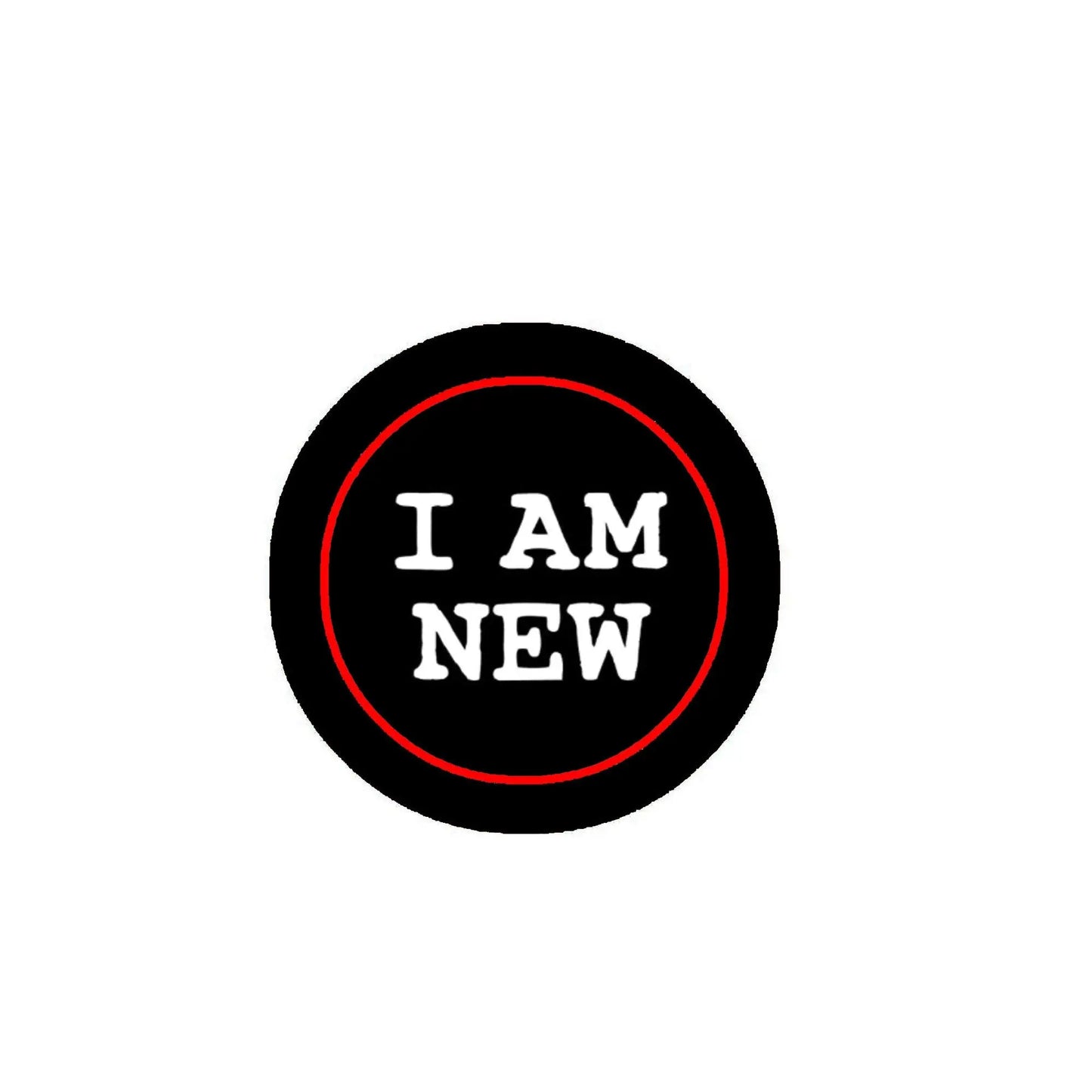Black round pinback badge with red ring and "I AM NEW" lettering
