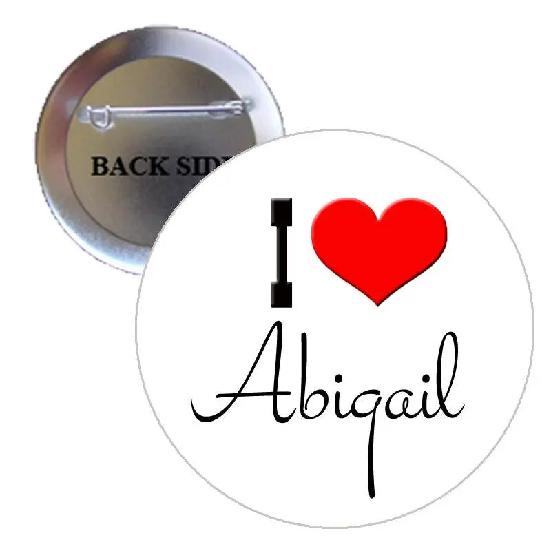 Round I Love Abigail pinback button with red heart, metal back visible
