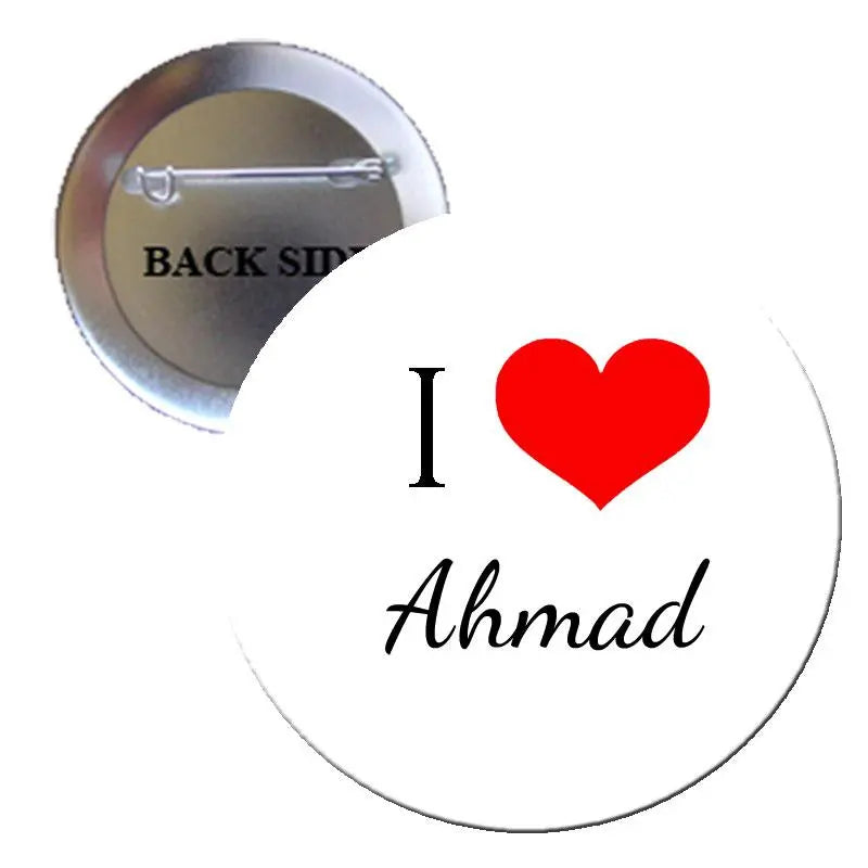 Round pinback button with red heart and 'I ♥ Ahmad' on white background