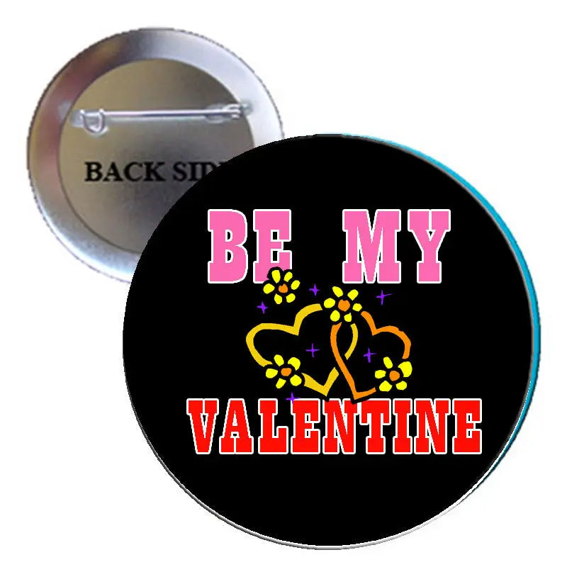 2.25-inch black pinback button with “BE MY VALENTINE” text and yellow decorative icons