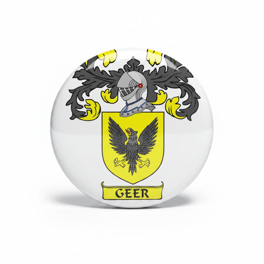 Yellow and black family crest pinback with shield, helmet, wings, and GEER text
