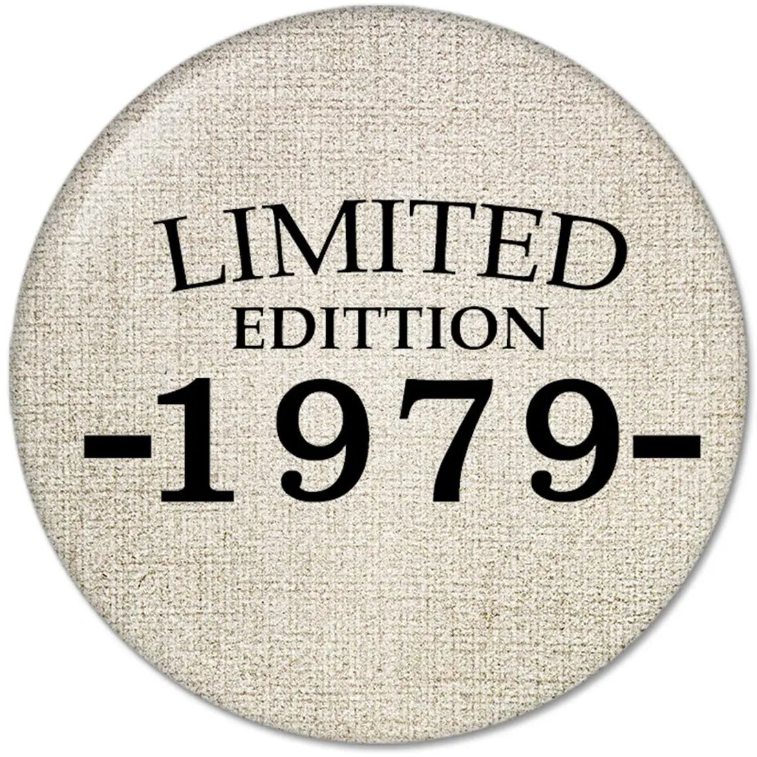Round pinback button, beige fabric texture, black 'LIMITED EDITION 1979' print