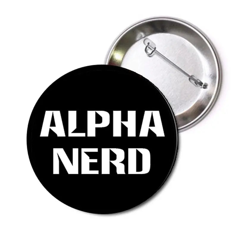 Round black pinback button with white 'ALPHA NERD' lettering and metal safety pin back.