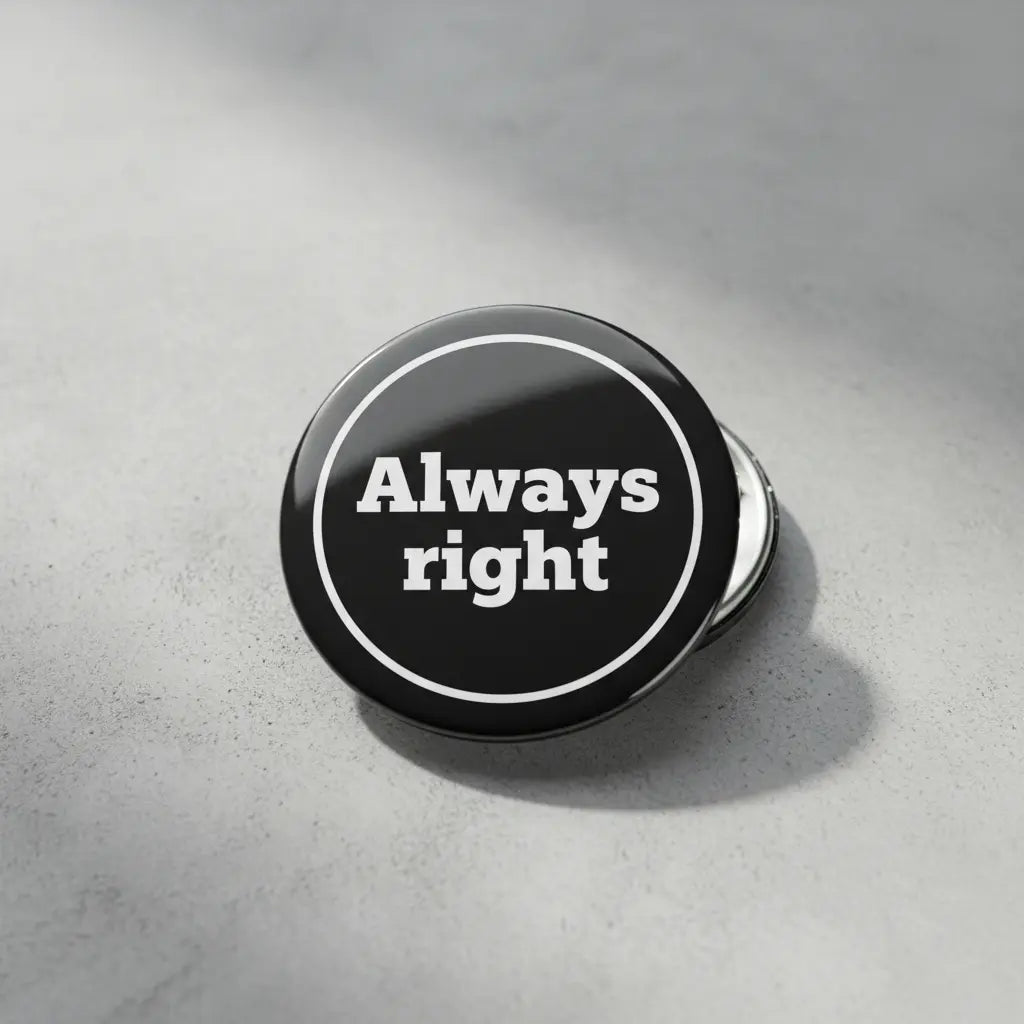 Pinback button, round black face with white “Always right” text and border