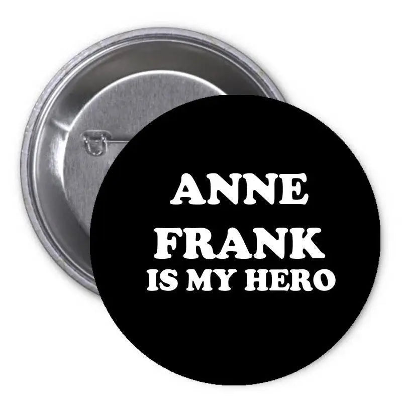 1.25-inch pinback button with black face and text 'ANNE FRANK IS MY HERO'