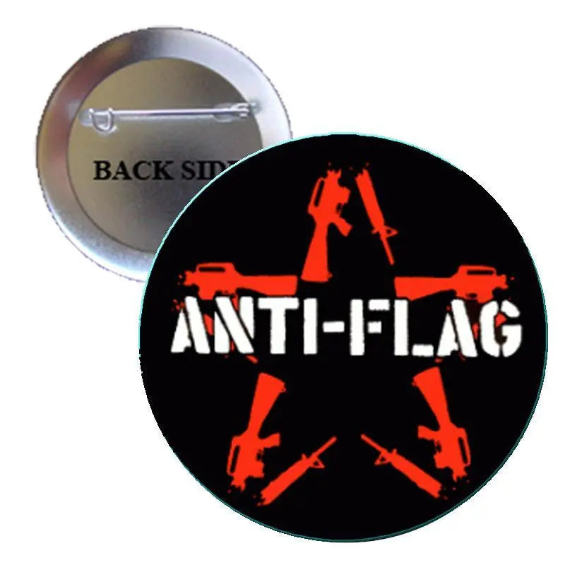 Round pin badge, black and orange anti-flag graphic, 2.25-inch