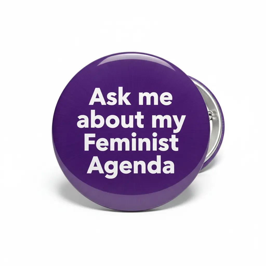 Purple pinback button with text "Ask me about my Feminist Agenda".