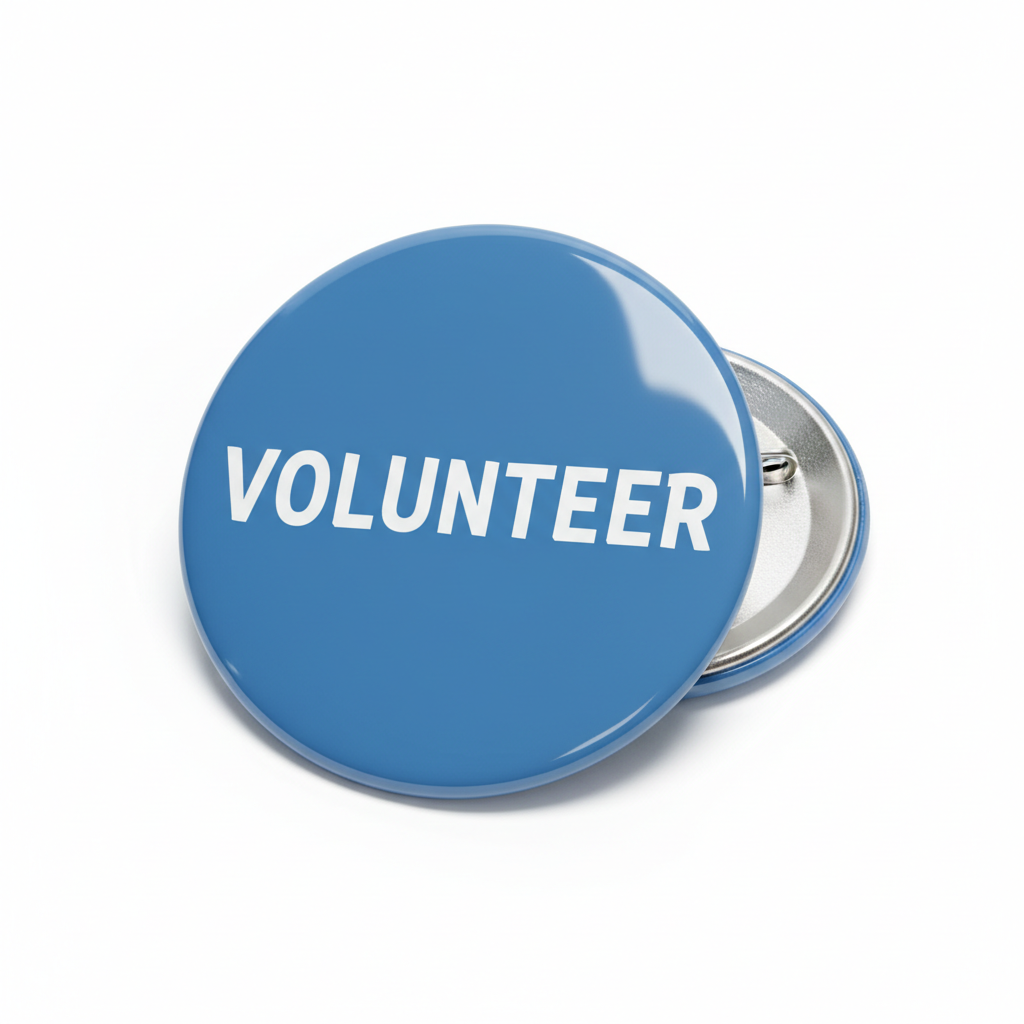 Blue volunteer Pin Button with white "VOLUNTEER" text and metal pin
