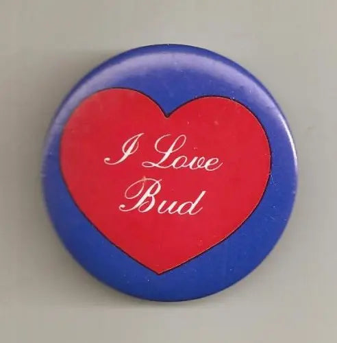 Blue pinback button with red heart reading 'I Love Bud'