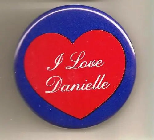 Round pinback button with red heart and white "I Love Danielle" text