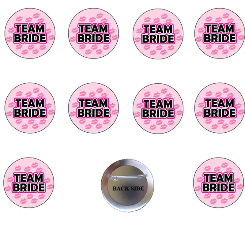 Set of round pink Team Bride pinback buttons with front text and one back metal pin