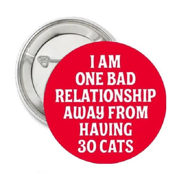 Red round pinback button with slogan text, I AM ONE BAD RELATIONSHIP