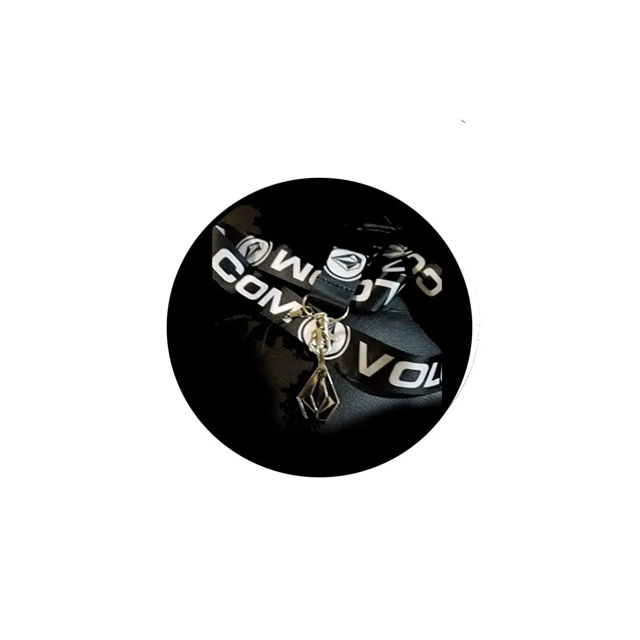 Black circular keychain with logo charm and metal clip