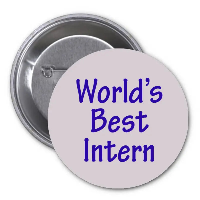 Round pinback button with 'World's Best Intern' text, metal clasp on back