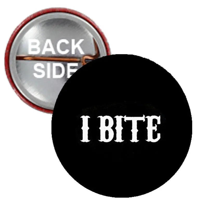 Black round pinback button with white "I BITE" text, smiling mouth graphic