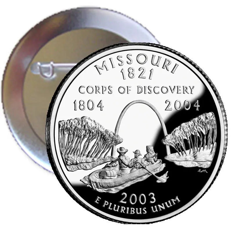Circular silver Missouri 1821 commemorative pinback with raised coin-style design and text