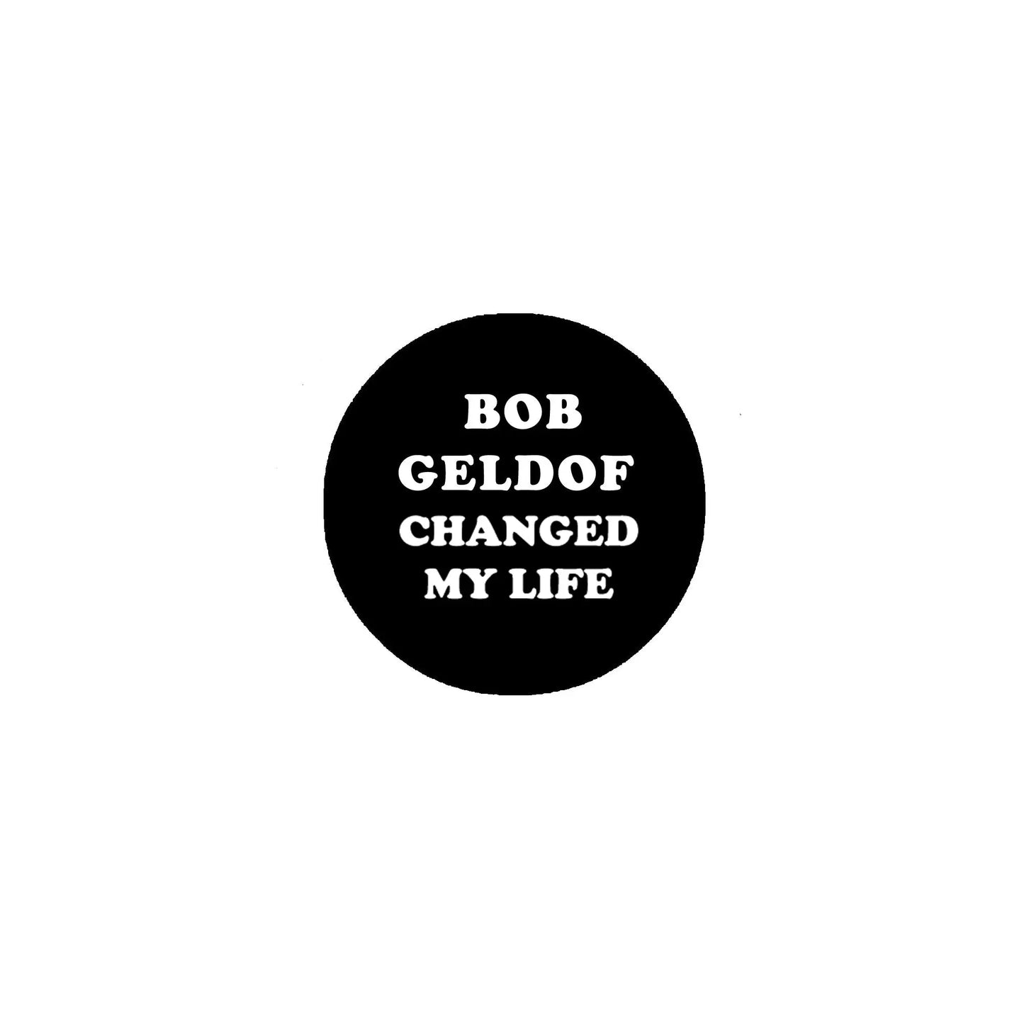 1.25-inch round black pinback button with white text: BOB GELDOF CHANGED MY LIFE