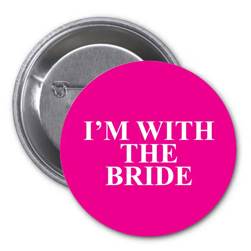 1.25-inch pinback button with pink face and white 'I'm with the Bride' text