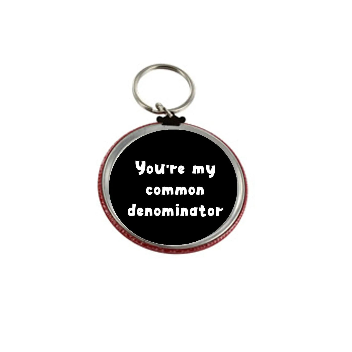 2.25-inch round keychain, black center, red rim, “You're my common denominator”