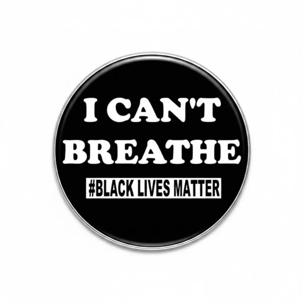 Round black pinback button with white text 'I CAN'T BREATHE' and '#BLACK LIVES MATTER'.
