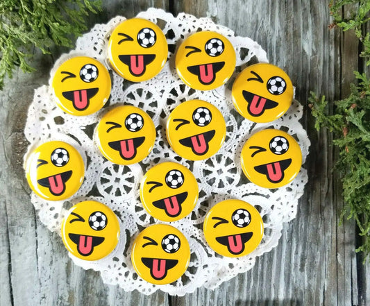 Yellow round pinback buttons with soccer-ball face graphic, multiple pins