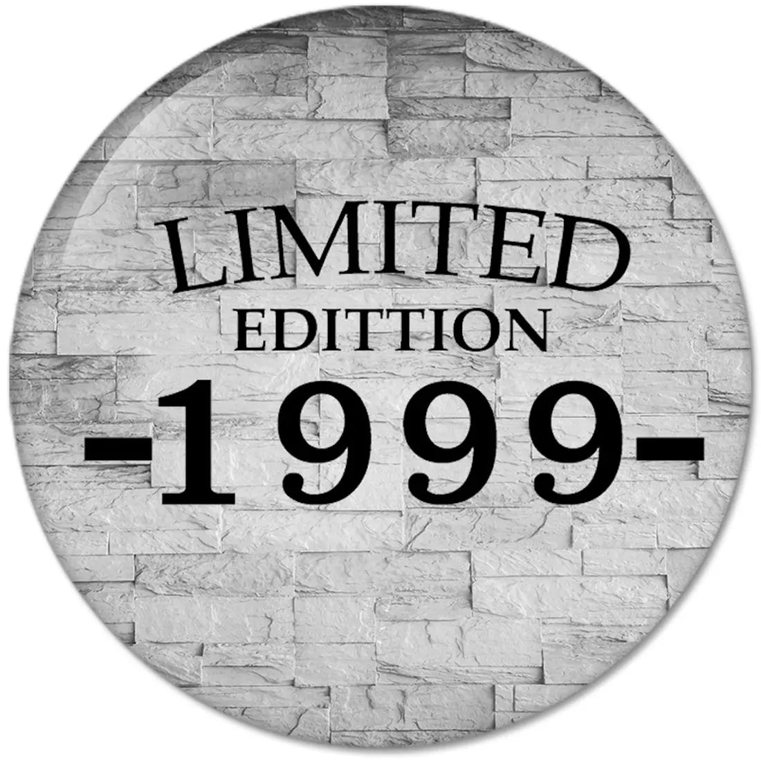 Round pinback button with gray brick background and 'LIMITED EDITION 1999' text