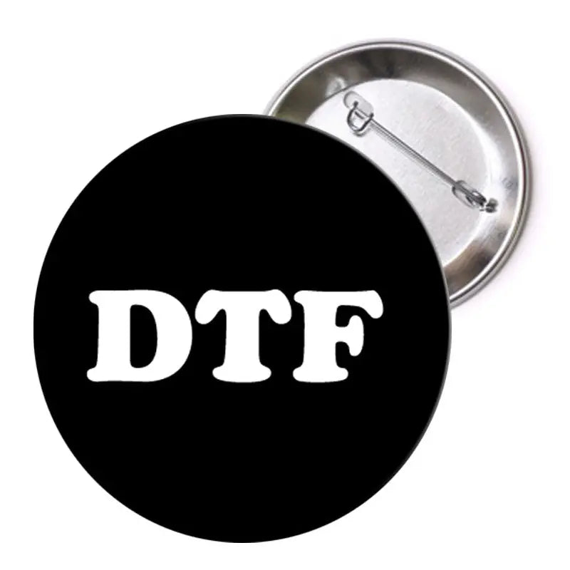 1.25-inch DTF pinback button with black background and white “DTF” text
