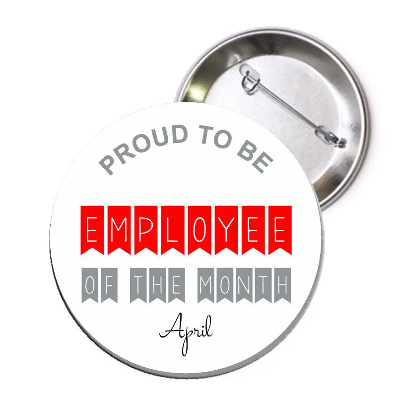 Round metal pinback badge with red and gray lettering: 'Employee of the Month' April