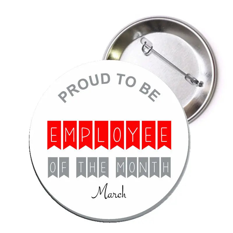 Round silver pinback badge with text 'Proud to be Employee of the Month' and 'March'