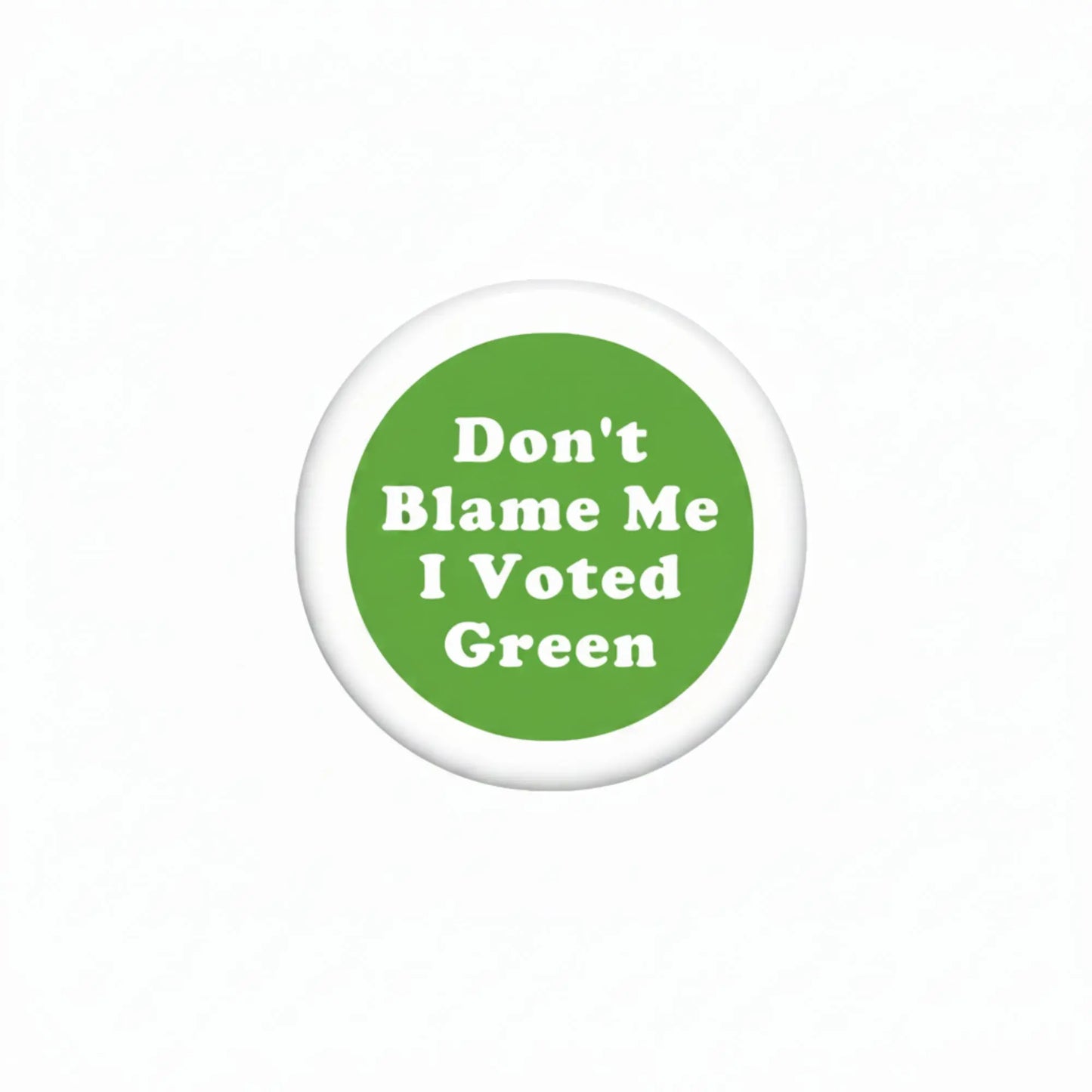 Round green pinback button with white text: "Don't Blame Me I Voted Green"