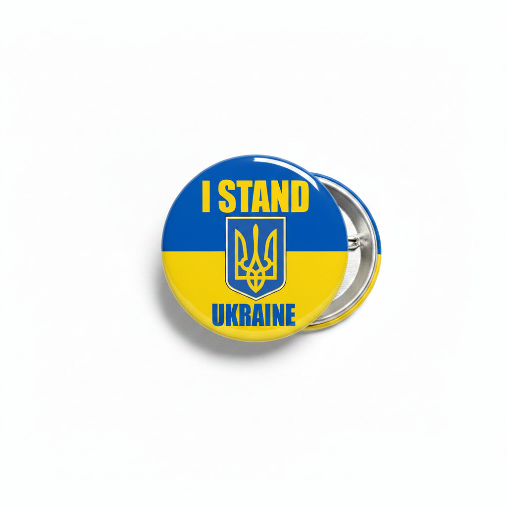 Round pinback button with blue-yellow Ukraine flag, 'I STAND UKRAINE' text, metal clasp back