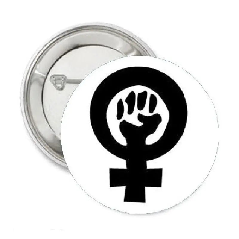 Round pinback button with black raised fist and female symbol
