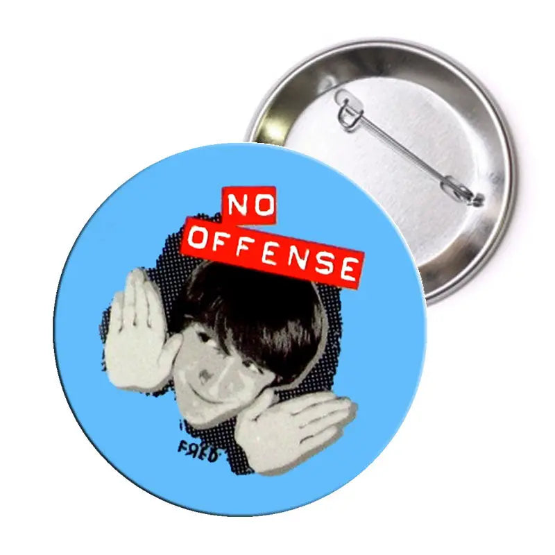 2.25-inch no offense pinback button, round blue design with red text and illustration