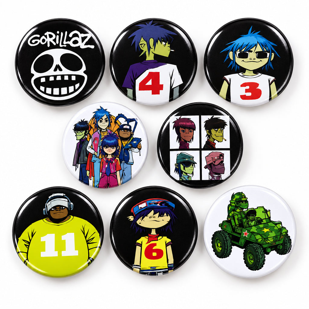 Twelve round Pin Buttons with assorted black, green, and multicolor designs