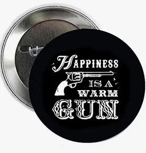 Round black pinback button with white text graphic and silver metal back