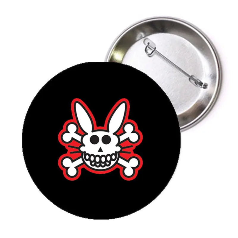 Black round pinback with bunny skull graphic and crossed bones, silver back clasp
