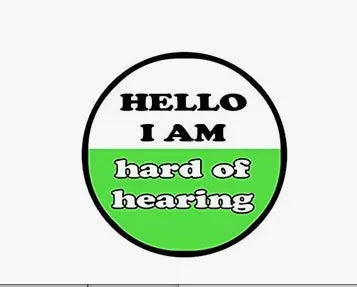 Round pinback button: "HELLO I AM" and "hard of hearing" text on green