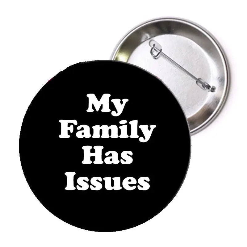 Round black pinback button with white text "My Family Has Issues" and silver backing